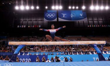 Biles competes on balance beam at the Tokyo Olympics.