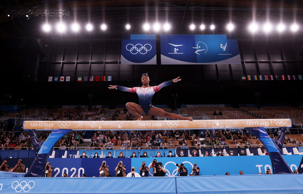 <i>Jamie Squire/Getty Images via CNN Newsource</i><br/>Biles competes on balance beam at the Tokyo Olympics.