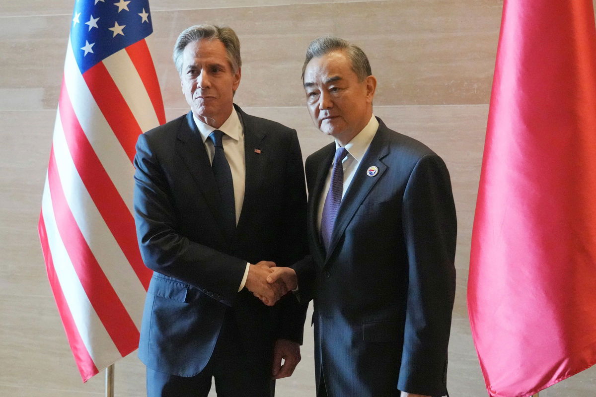 <i>Achmad Ibrahim/AP via CNN Newsource</i><br/>US Secretary of State Antony Blinken shakes hands with Chinese counterpart Wang Yi on the sideline of the ASEAN foreign ministers' meeting in Vientiane