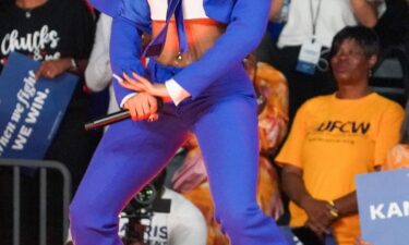 Megan Thee Stallion's midriff-bearing blue suit was designed by Abdul Sall.