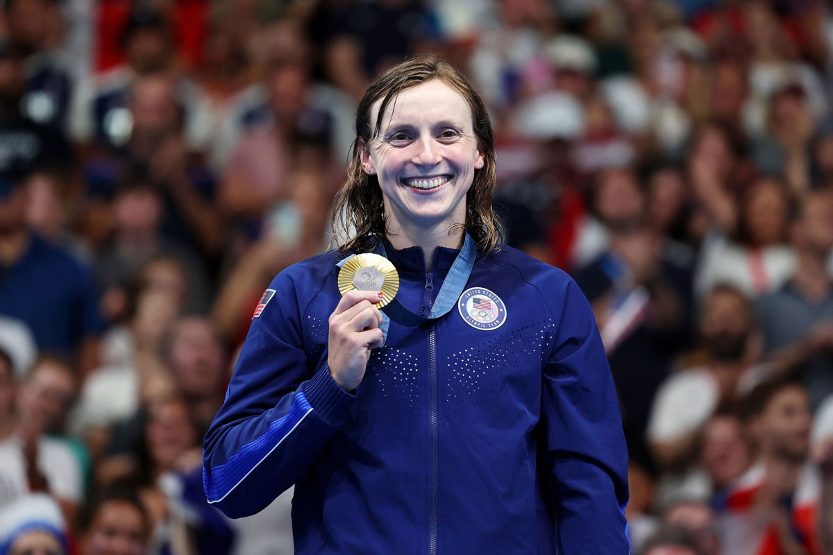 <i>Quinn Rooney/Getty Images via CNN Newsource</i><br/>Ledecky poses with her first gold of these Games.