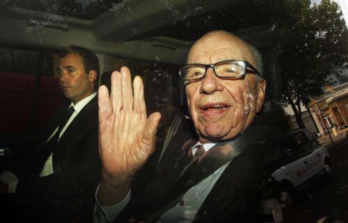 Rupert Murdoch leaves News International headquarters with then-News International Group General Manager Will Lewis in 2011.