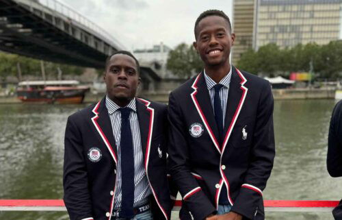 Olympians and former high school classmates Christian Coleman (track and field) and Chris Eubanks (tennis) pose together on the Team USA boat during the Opening Ceremony in Paris.