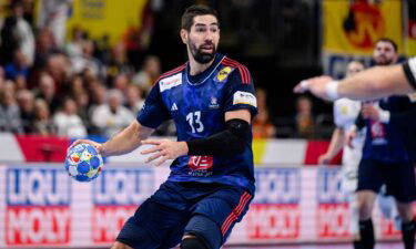 Nikola Karabatic holds the ball during a handball match.