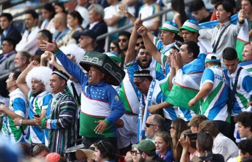 Uzbekistan fans celebrate country's first ever goal at a major tournament.