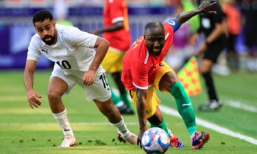 Guinea player dribbles with the ball.