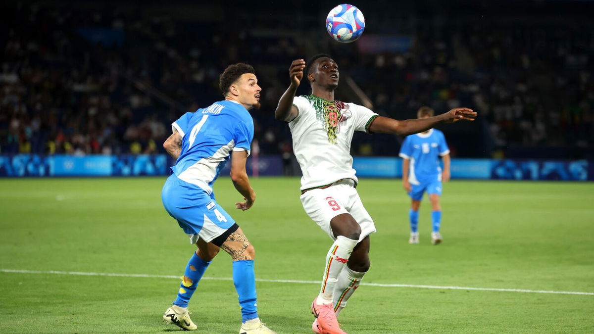 Two players vie for a ball in the air