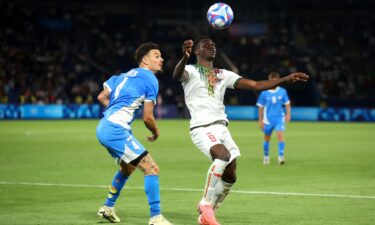 Two players vie for a ball in the air