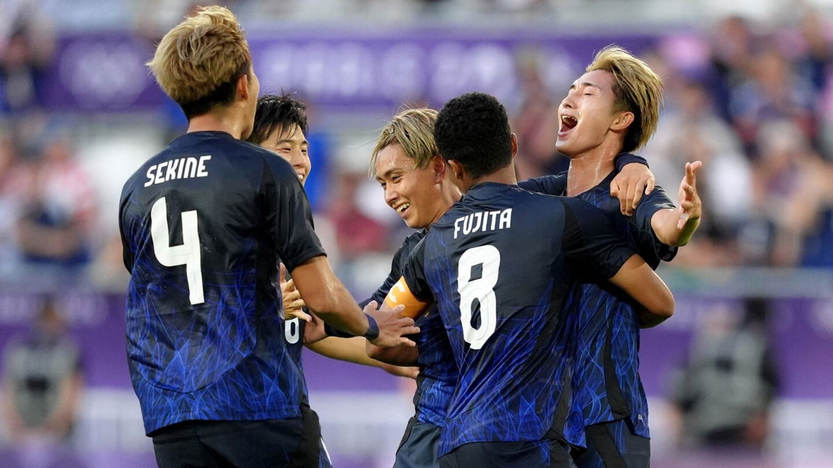 Japan player celebrate scoring a goal.