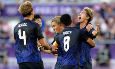 Japan player celebrate scoring a goal.