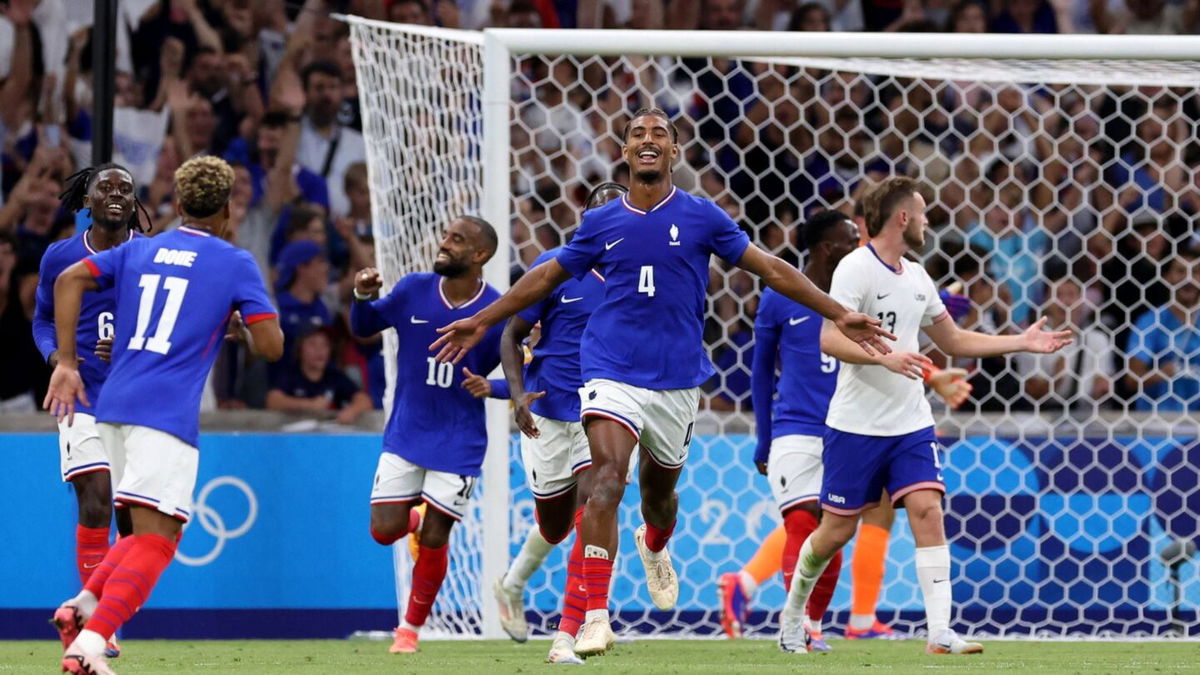 France players celebrate after scoring a goal.