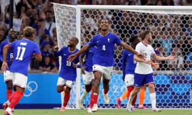 France players celebrate after scoring a goal.