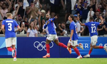 France players celebrate after scoring a goal.