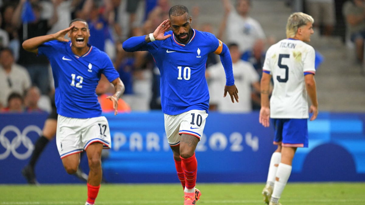 France players celebrate after scoring a goal.