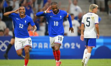 France players celebrate after scoring a goal.