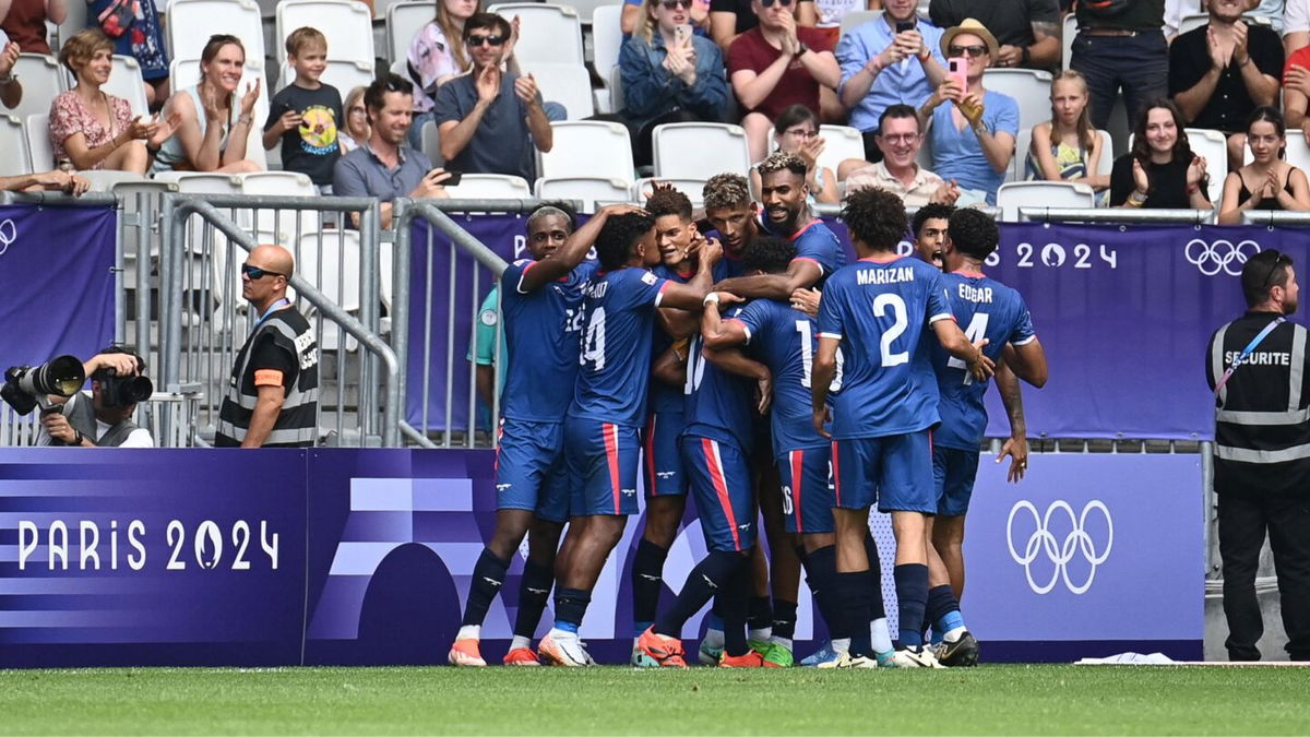 Dominican Republic players celebrate after scoring a goal.