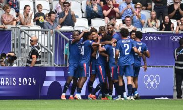 Dominican Republic players celebrate after scoring a goal.