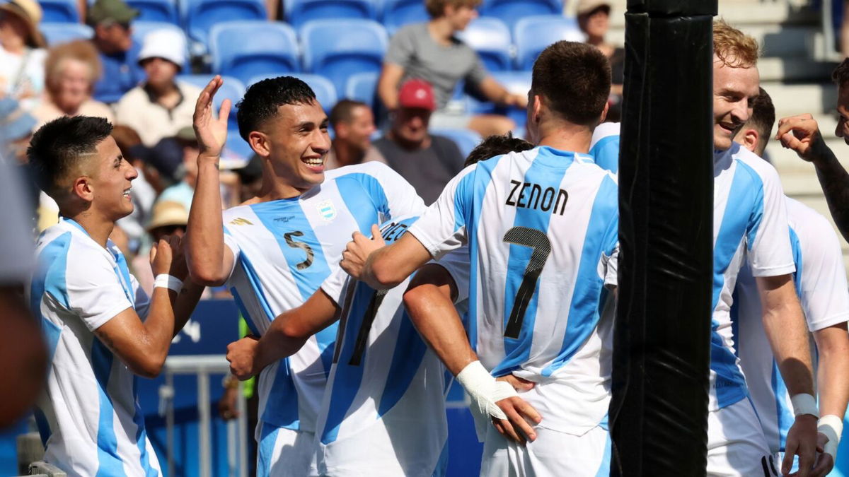 Argentina players celebrate after scoring a goal.