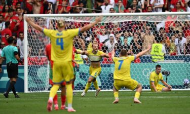 Ukraine players celebrate after scoring a goal.