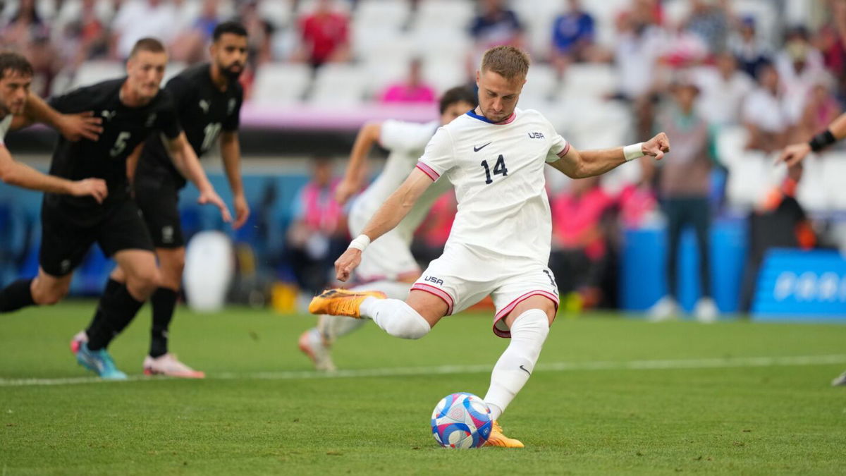 USA players celebrate after scoring a goal.