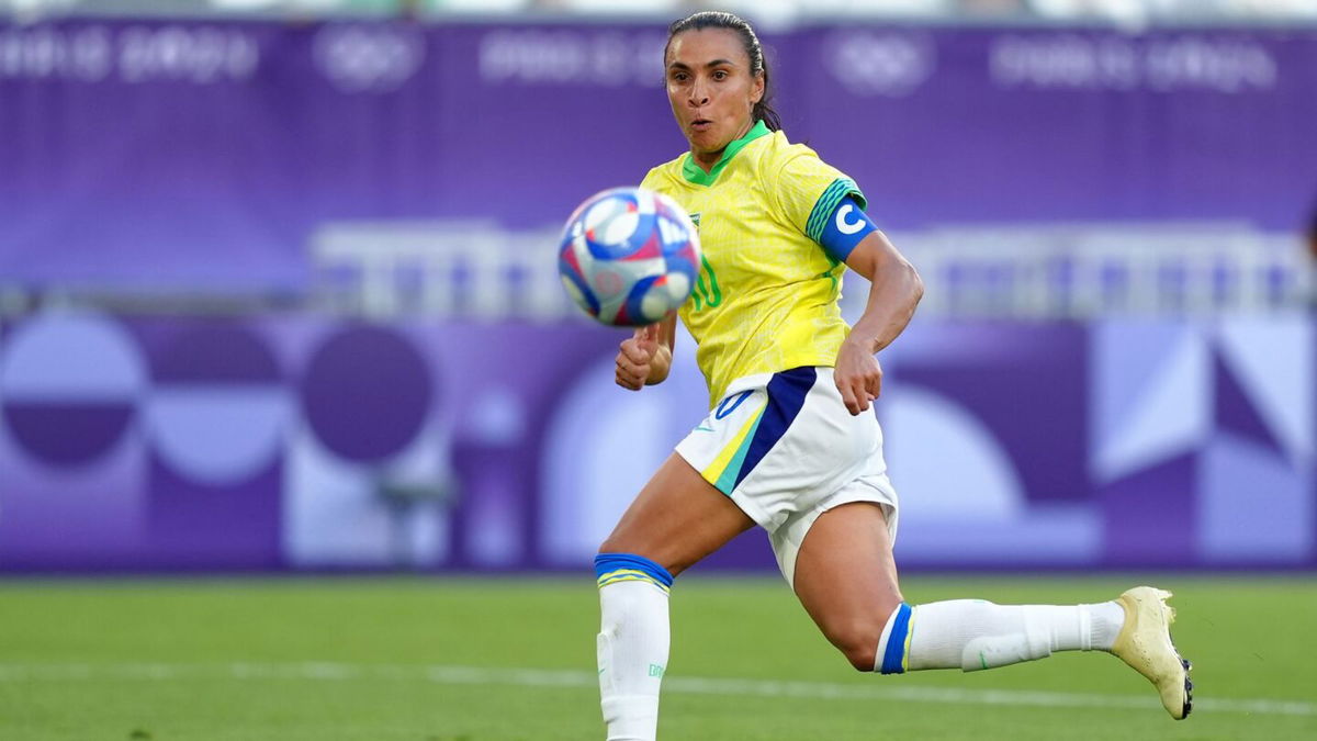 Marta looks at the ball.