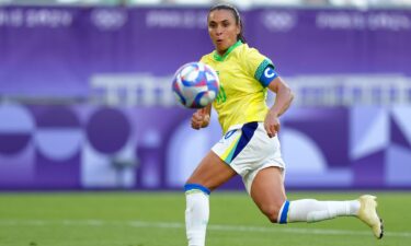 Marta looks at the ball.