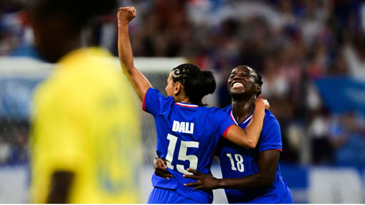 France players celebrate after scoring a goal.