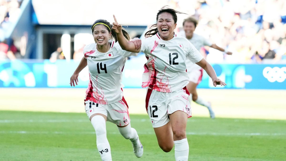 Japan player celebrate after scoring a goal