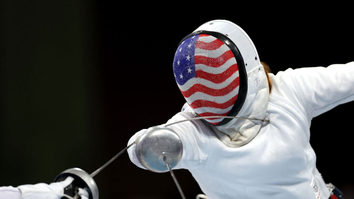 American fencer lunges