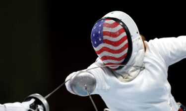 American fencer lunges