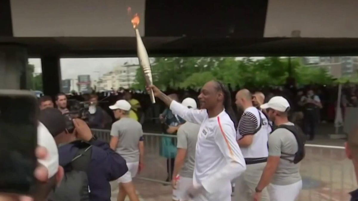 Snoop Dogg carries Olympic flame ahead of Opening Ceremony