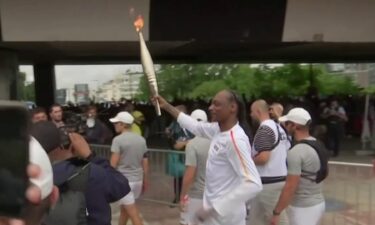 Snoop Dogg carries Olympic flame ahead of Opening Ceremony