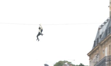 Olympic torch ziplines over River Seine