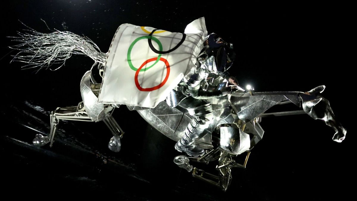 Metal horse gallops down Seine River during Opening Ceremony