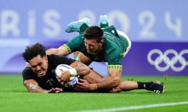 South Africa makes a tackles a New Zealand player.