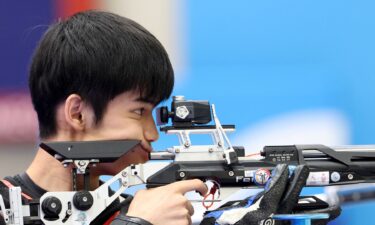 Sheng Lihao competes in 10m mixed team air rifle final