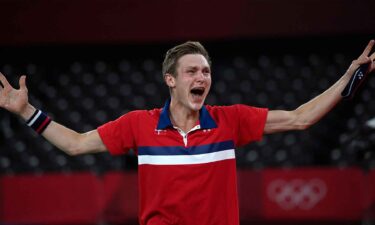 Denmark's Viktor Axelsen celebrates after beating China's Chen Long to win their men's singles badminton final match during the Tokyo 2020 Olympic Games at the Musashino Forest Sports Plaza in Tokyo on August 2