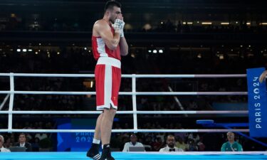 Super heavyweight Bakhodir Jalolov reacts after winning gold