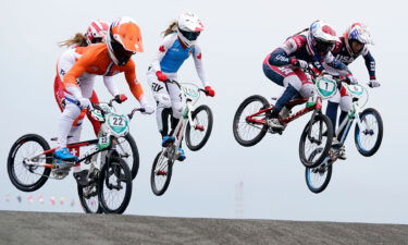 Multiple riders in the air during a BMX race