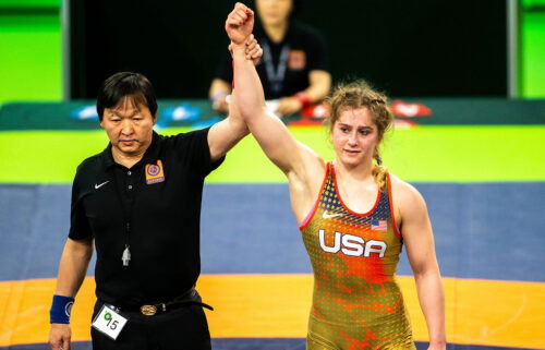 Amit Elor's arm is raised by a referee