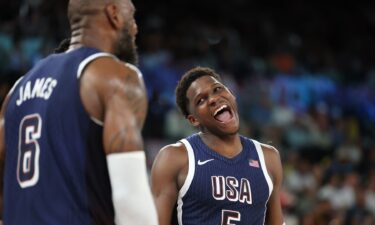 Anthony Edwards smiles at LeBron James during Brazil game