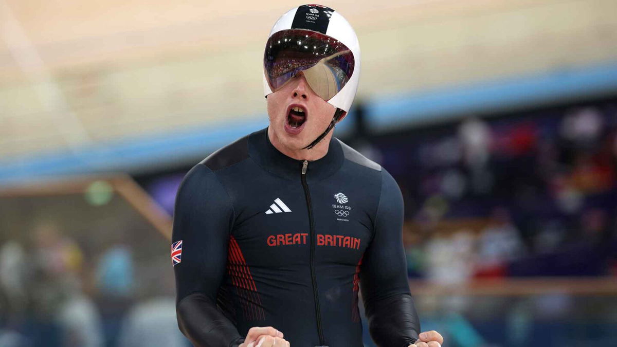 Jack Carlin celebrates winning the bronze medal in the men's sprint.