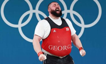 Lasha Talakhadze of Georgia celebrates after performing a lift at the 2024 Paris Olympics.