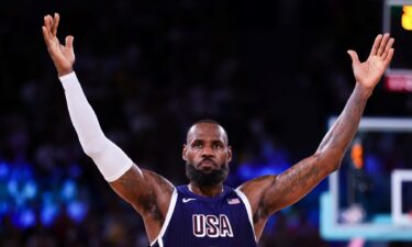 LeBron James holds up his arms vs. Brazil