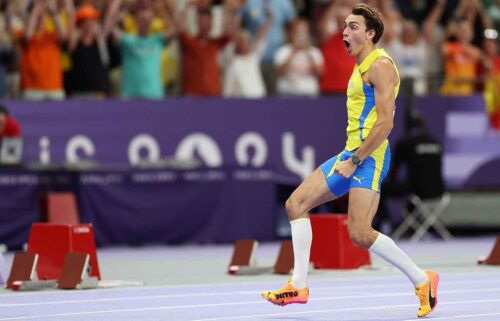 Gold medalist Mondo Duplantis of Sweden celebrates after setting a new world record during the men's pole vault at the 2024 Paris Olympics.