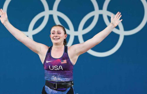 American weightlifter Olivia Reeves celebrates winning a gold medal in the women's 71kg (156 lbs.) competition.