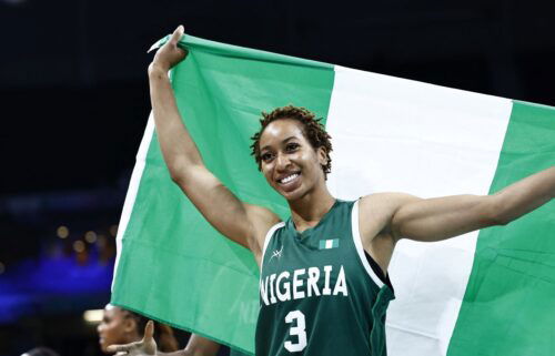 Pallas Kunaiyi-Akpanah holds flag after win vs. Canada