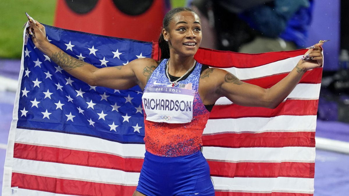 Sha'Carri Richardson celebrates after winning silver medal