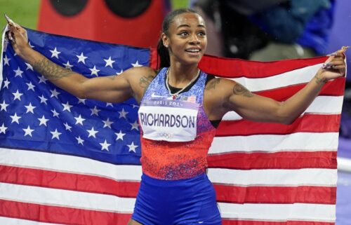 Sha'Carri Richardson celebrates after winning silver medal