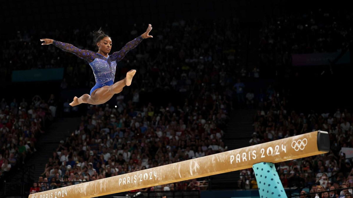 Simone Biles competes on balance beam during the all-around final at the 2024 Paris Olympics.